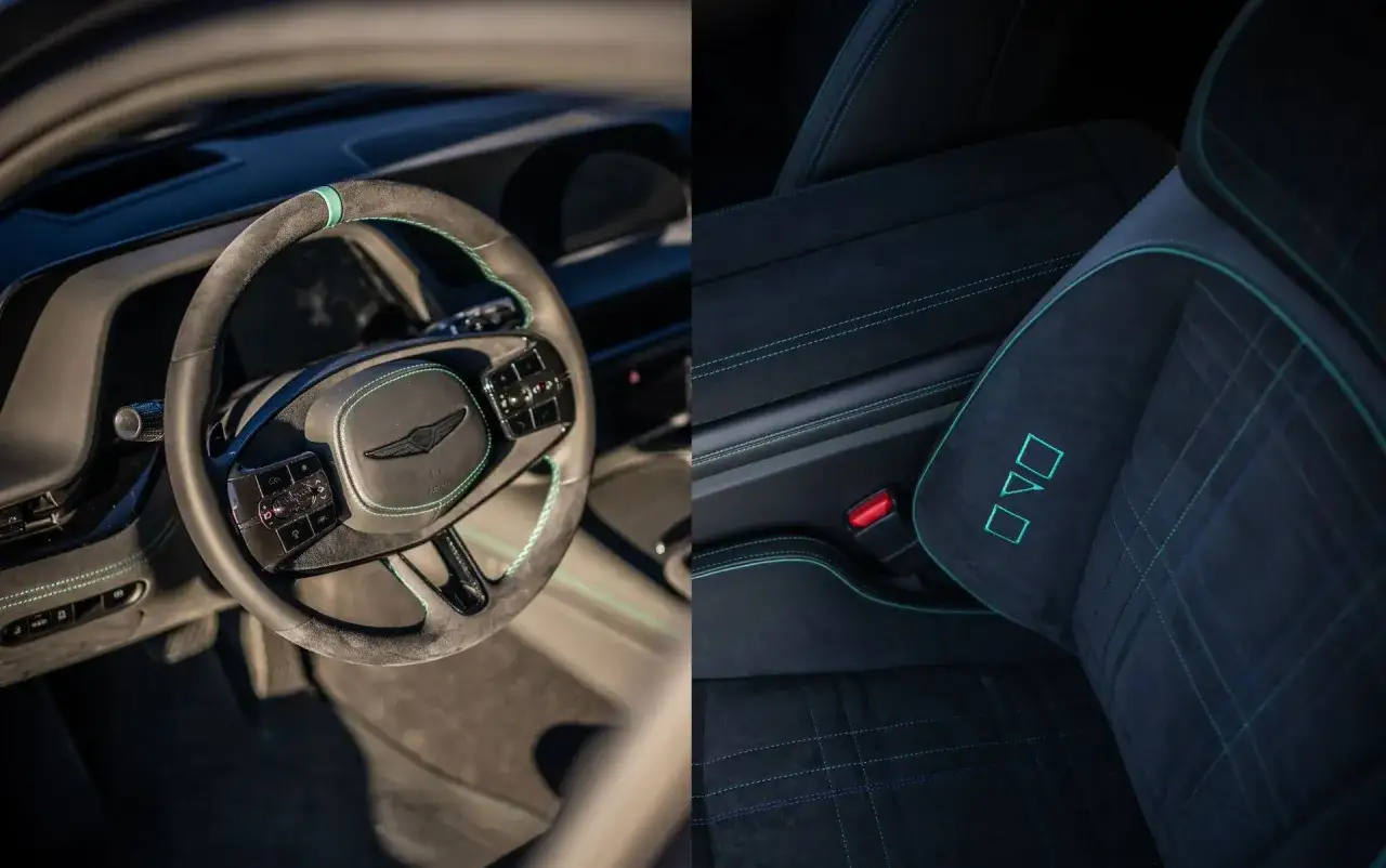 Wnętrze Genesis G90: kierownica z zielonymi przeszyciami i logo, oraz siedzenie z charakterystycznym wzorem i turkusowymi detalami.